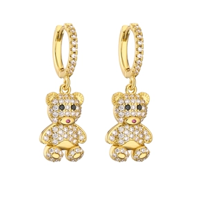 Macro shot of bear drop earrings with gold plating and white sparkling cubic zirconia