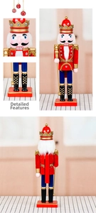Close-up detail of 36cm wooden nutcracker king showing golden scepter and fabric uniform