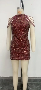 Detail of burgundy sequin party dress with tiered bead tassels on the halter neckline