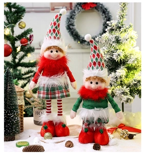 Detailed view of plush Christmas elf dolls with telescopic legs on a snowy background