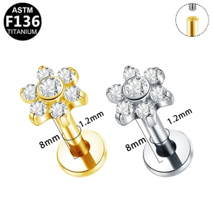 Macro detail of G23 titanium flower labret stud with zircon inlay and 1.2mm thread