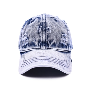 Vintage washed denim baseball cap with distressed rip details and a classic retro look