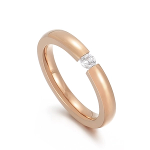 Minimalist rose gold stainless steel ring with a round white zircon in tension setting