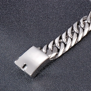 Detailed close-up of a silver stainless steel Cuban link bracelet with a secure clasp