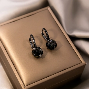 Vintage square black crystal hoop earrings on luxury satin background for women