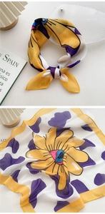 Close-up of lightweight sunflower print neck scarf featuring yellow and purple floral patterns