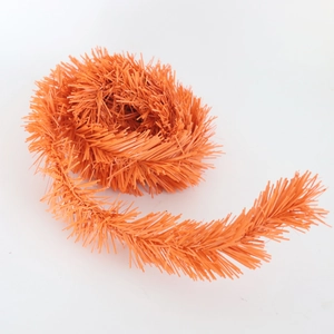 Decorative bright orange PVC pine needle garland for festive home party decor