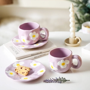 Artistic purple hand-pinched ceramic coffee set with hand-painted floral egg patterns
