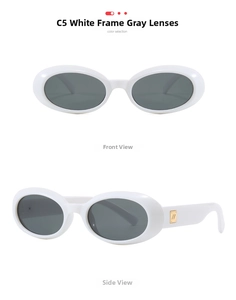 Detail view of oval white sunglasses with dark grey lenses and gold logo accents