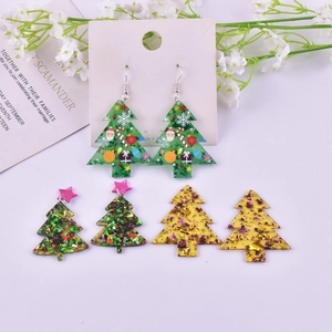 Three pairs of festive acrylic Christmas tree earrings in green and gold glitter patterns