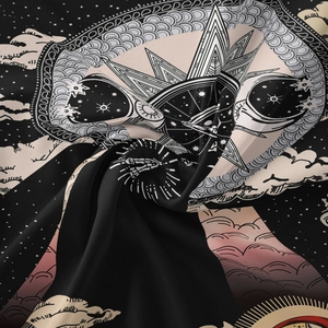 Detail of bohemian skull tapestry featuring celestial sun, moon, and mystic hand prints