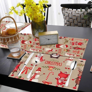 Close-up of linen texture Christmas table runner set with festive reindeer print