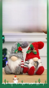 Detail of Christmas gnomes with knitted hats and artificial fur in red and grey colors