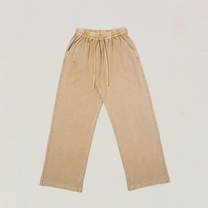 Detailed macro shot of vintage khaki corduroy pants showing elastic waistband and drawstring