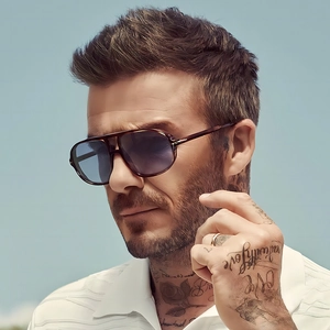 Classic pilot sunglasses with double bridge and gradient lenses worn by model