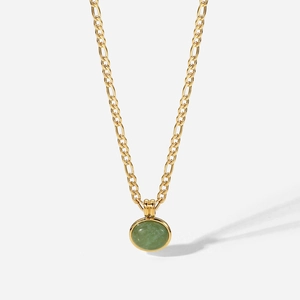 Detail of green aventurine stone pendant on vintage 18K gold-plated Figaro chain