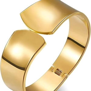 Polished gold stainless steel wide bypass bangle with a sleek minimalist hinged design