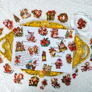50 vintage Christmas PET stickers featuring Santa, reindeer, and snowmen on a golden tray