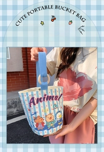 Detail of blue striped canvas bucket bag with cute animal illustrations and wood ring buckle