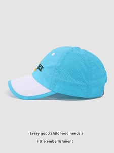 Detail of blue and white kids' mesh baseball cap with HX embroidery and breathable fabric