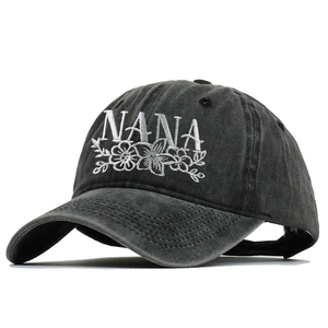Classic washed black baseball cap with white NANA embroidery and floral design