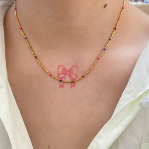 18k gold plated stainless steel bamboo chain necklace with colorful beads on a model