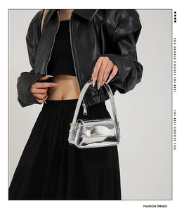 Detailed view of a silver mirror-finish mini handbag with sleek Y2K metallic texture