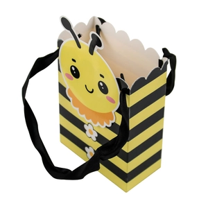 Bee themed candy gift box with yellow stripes and black ribbon handles for parties