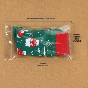 Detail of Christmas crew socks with polar bear motif in clear OPP packaging