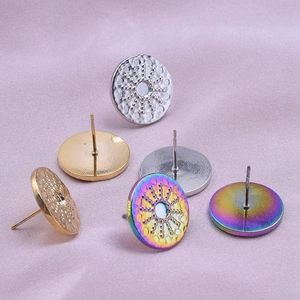 Detailed view of six 304 stainless steel round stud earrings in silver gold and rainbow