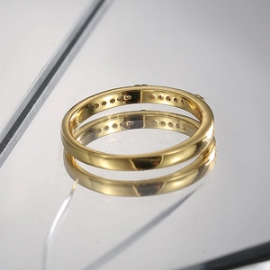 Detailed view of a gold-plated heart ring featuring micro-set zircon on a mirror surface