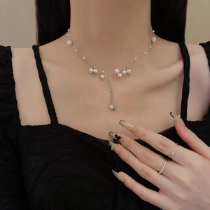 Elegant pearl fringe pendant necklace with thin zircon ring on minimalist lady