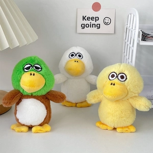 Three cute plush ducks in green, white, and yellow colors for backpack decoration