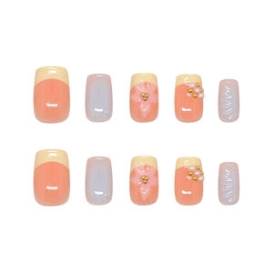 Handmade press-on nails with peach floral designs and 3D pearls on short square tips
