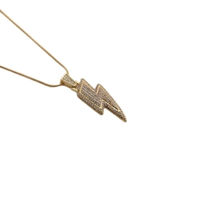Polished gold lightning bolt pendant necklace with cubic zirconia on thin snake chain