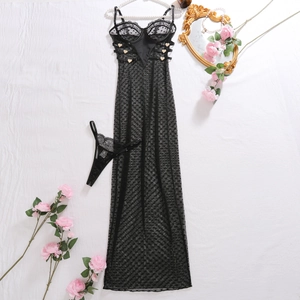 Flat lay of black lace long slip dress with heart buttons and rose flower decorations