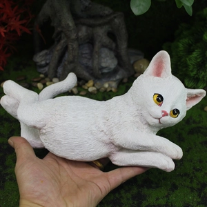 Realistic white resin cat figurine with detailed fur texture and yellow eyes for garden decor