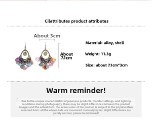 Detail view showing dimensions 7.1cm by 3cm and 11.3g weight of shell drop earrings