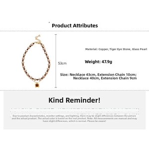 Detailed specs of double-layer tiger eye stone and pearl necklace with square pendant
