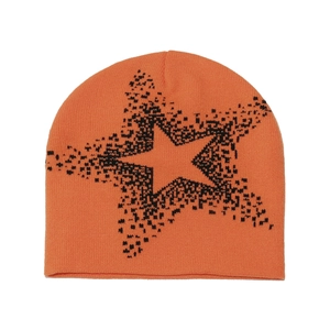 Detail of orange knit beanie featuring a black star jacquard and thick texture