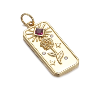 Golden rectangular pendant featuring rose and sun engraving with a red gemstone inlay