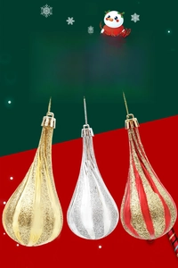 Detail of glitter pumpkin waterdrop ornaments in gold, silver and red stripes for tree