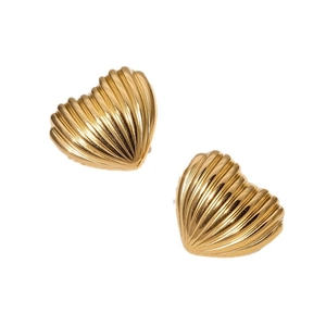 Golden heart earrings with textured 3D wave pattern on a white minimalist background