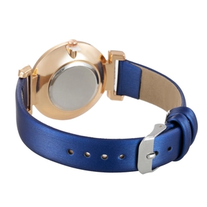 Back view of a rose gold quartz watch with a blue leather strap and silver buckle