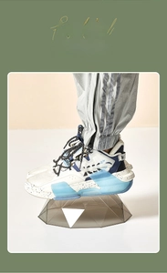 Detail of multi-color athletic sneaker with transparent cushioning and heavy-duty support