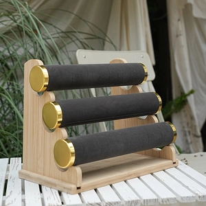 Three-tier bamboo and black velvet jewelry display stand for bracelets and watches