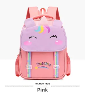 Detail of pink unicorn school backpack featuring 3D ears and rainbow strap accents