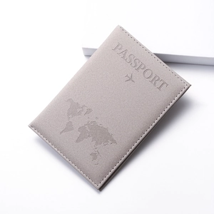Detail of world map embossing and Passport text on premium matte PU leather cover