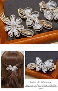 Close-up of alloy butterfly hair clip set with sparkling zircons and white crystals