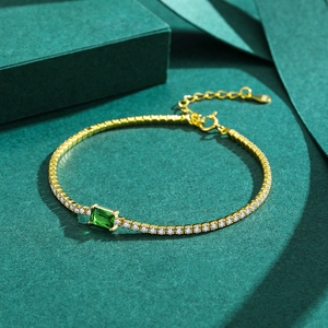 Gold tennis bracelet with micro-paved emerald green zircon and adjustable clasp